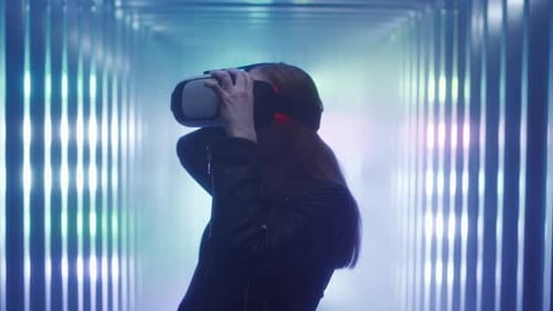 Woman Uses VR Headset in Futuristic Room