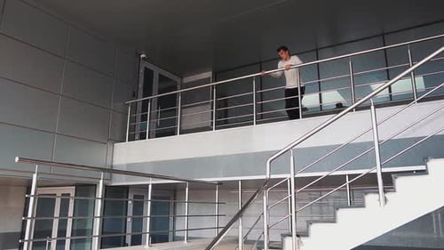 Young Adult Performs Parkour On Urban Building