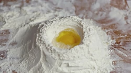 Egg Poured into Flour Well, Baking Ingredient