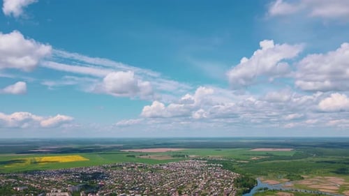 Aerial View of Rural Community with Forests and Fields