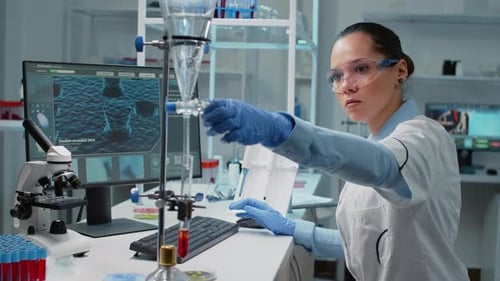 Female Scientist Working in Modern Lab