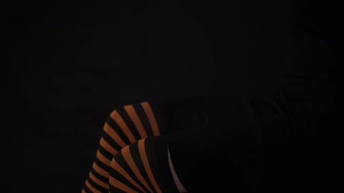 Woman in Dress Crossed Legs Open Them and Cross Again Side View