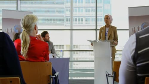 Speaker Presenting at a Corporate Conference in City Office