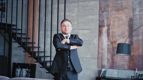 Confident Young Man in Suit Posing Indoors