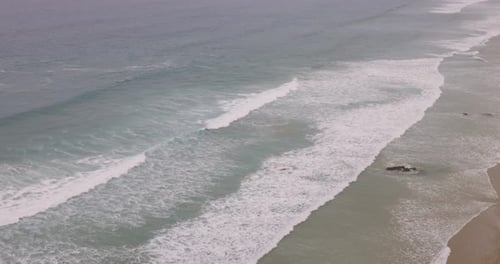 Cornwall seaside view with waves and cliffs