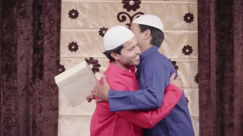 Indian man giving gift on Eid