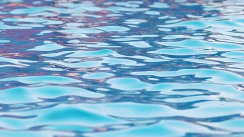 Pure Blue Water in Pool with Light Reflections
