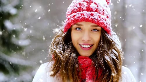 Portrait of Happy Smiling Woman Outdoors in Winter