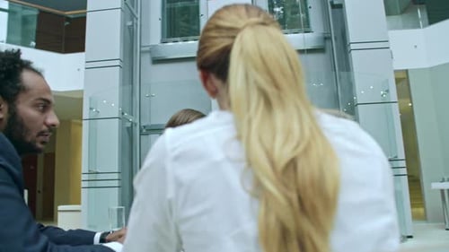 Business Discussion in Modern Office Center