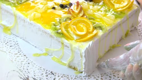 Icing Being Added to Decorated Cake