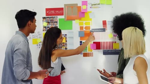 Young Adults Brainstorming Design Ideas in Workplace