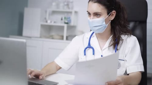Physician working in clinic during pandemic