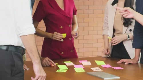 Close up of business people group having a discussion meeting brainstorming and working in office.