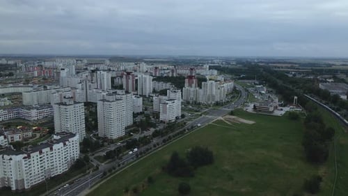 City block. Modern multi-storey buildings. Flying at dusk at sunset.