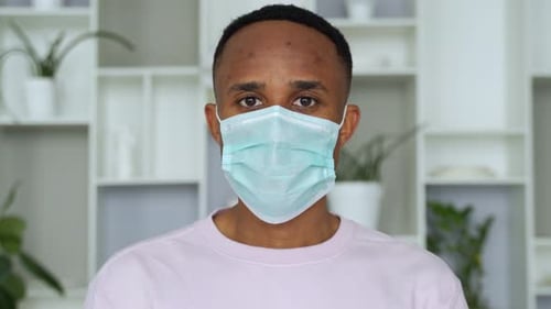 Man Wearing Medical Face Mask Indoors Close Up