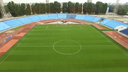 Drone View To Green Soccer Field on Stadium in the City