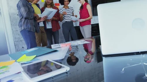 Diverse Team Collaborates in Modern Office Setting