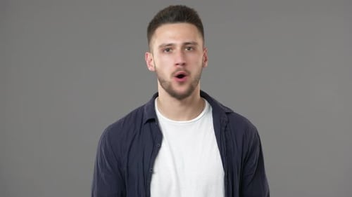 Portrait of Irritated Man with Short Dark Hair Strictly Gesturing Finger in Denial and Meaning No or