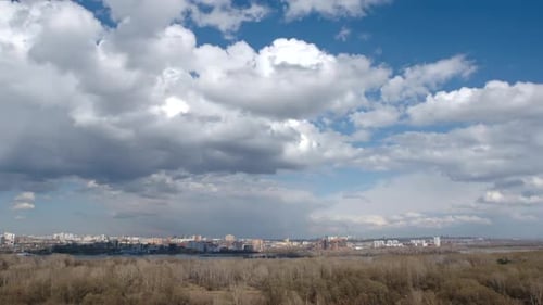 Cloudscape over a town and a park