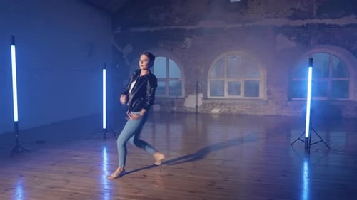 Woman Dancing Ballet in a Blue Lit Studio