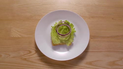 Assembling and Eating a Delicious Sandwich on Plate