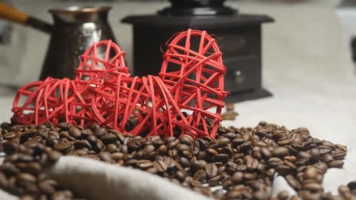 Close Up of Coffee Beans and Red Hearts