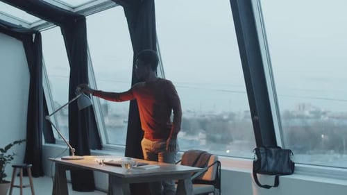 African Businessman Finishing Work and Leaving Office