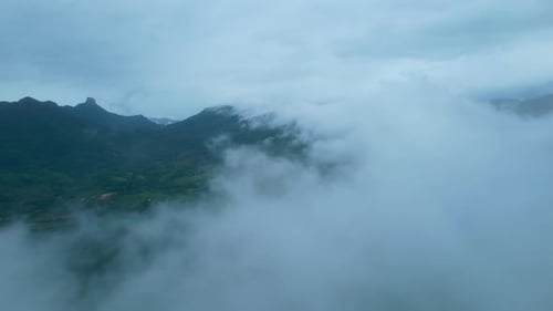 4K Aerial Drone shot flying over beautiful mountain ridge in rural jungle bush forest.