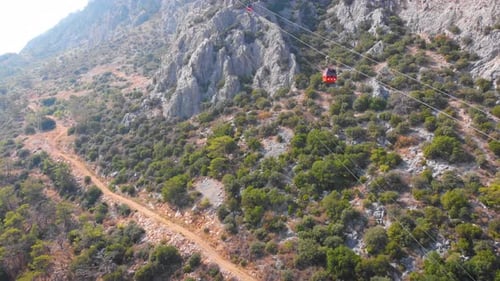 Close-up Flight Next To the Uphill Funicular with the Coast in the Background