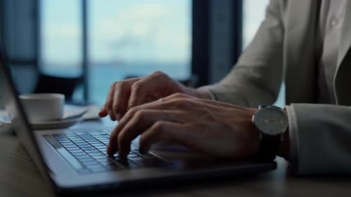 Unrecognizable Businessman Work on Laptop at Sea Office
