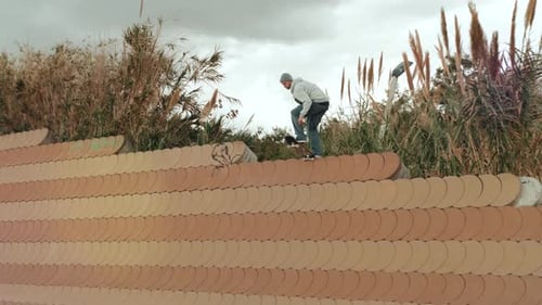 Skateboarder Doing Dangerous Stall Trick on Street, Skater Man Perform Extreme Big Gap Professional