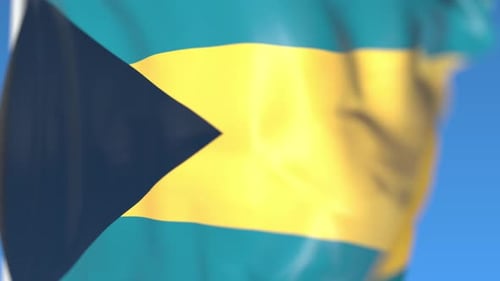 Bahamas National Flag Waving Seamless Loop Against Blue Sky