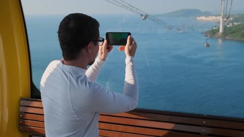 Man Capturing Amazing View From Cable Car in Phu Quoc Vietnam