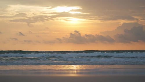 Sea waves on sunset.