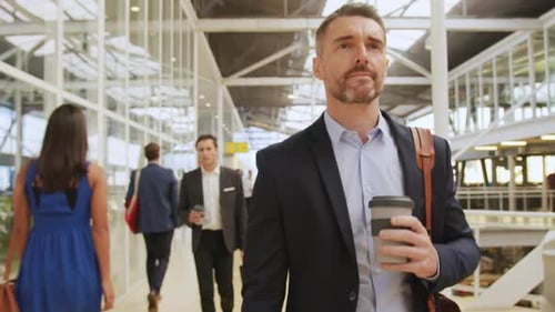 Business People Walking in Airport Commuting