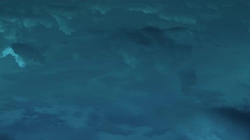 Abstract Aerial View of Swirling Teal Clouds