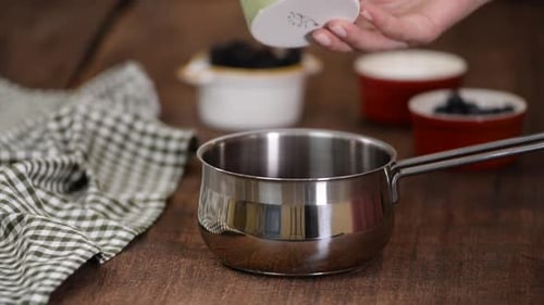 Adding Fresh Berries to Cooking Pot