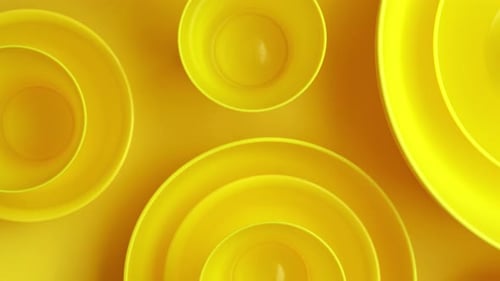 New Clean Yellow Bowl on Yellow Background. Top View