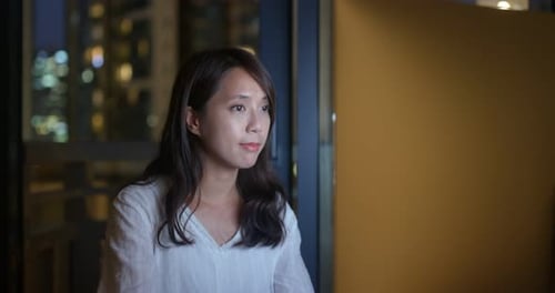 Asian Woman Working Over Night on Computer