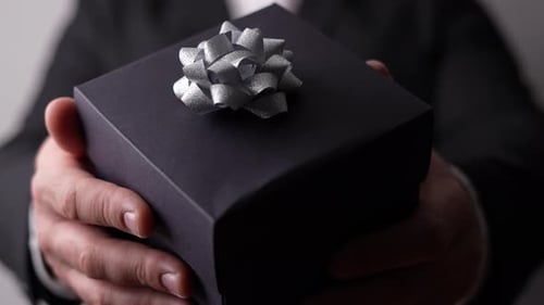 Elegant Gift Box Presented by Person