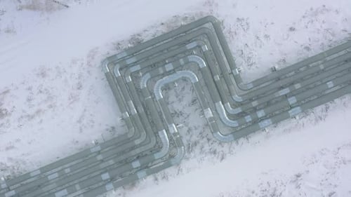Pipelines Over Snowy Land at Gas and Oil Refinery Plant