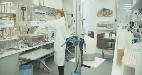 Female Scientist Working in Modern Laboratory