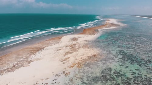 Ocean Coastline and Barrier Reef at Low Tide Zanzibar Matemwe Aerial View