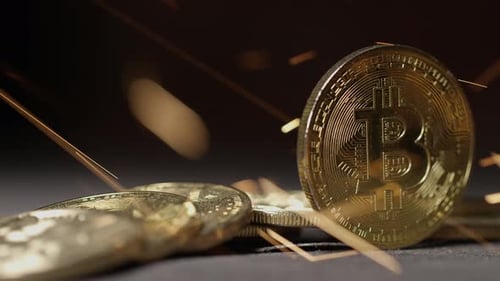 Cryptocurrency on the block chain - close up of bitcoin altcoin physical coins in dynamic setting
