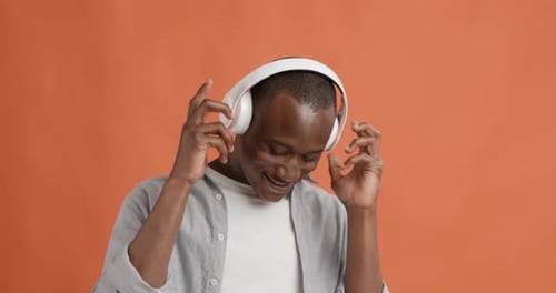 Man Listening to Music and Dancing with Headphones