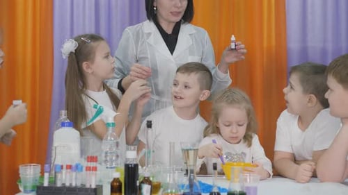 Kids Learn Science with Teacher in Classroom Setting