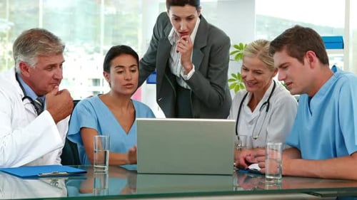 Medical Team Meeting at Hospital Conference Table