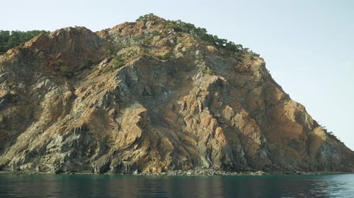 Huge brown mountain on the sea coast