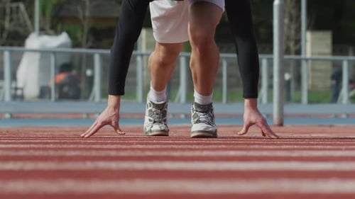 Athlete Preparing For A Sprint on Track