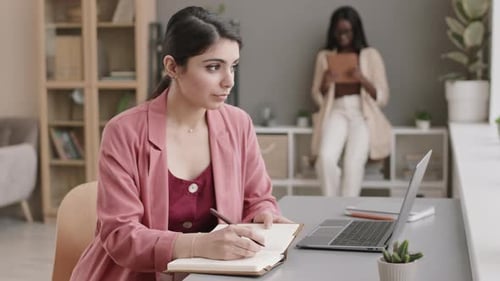 Young Mixed-race Businesswoman Working in Office